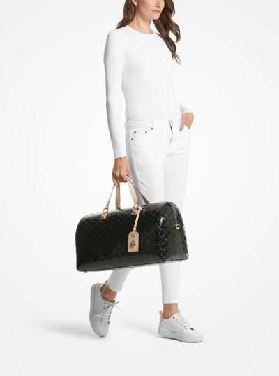 Grayson Extra-Large Logo Embossed Patent Weekender Bag in BLACK | Michael Kors