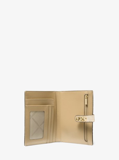 Empire Metallic Crocodile Embossed Leather Passport Wallet in PALE GOLD | Michael Kors