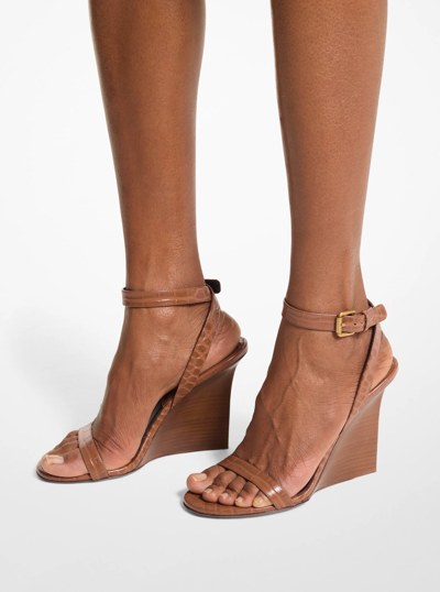 Claudia Crocodile Embossed Leather Wedge Sandal in SADDLE | Michael Kors
