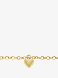 Pulsera con colgante de coraz&oacute;n acolchado pav&eacute;