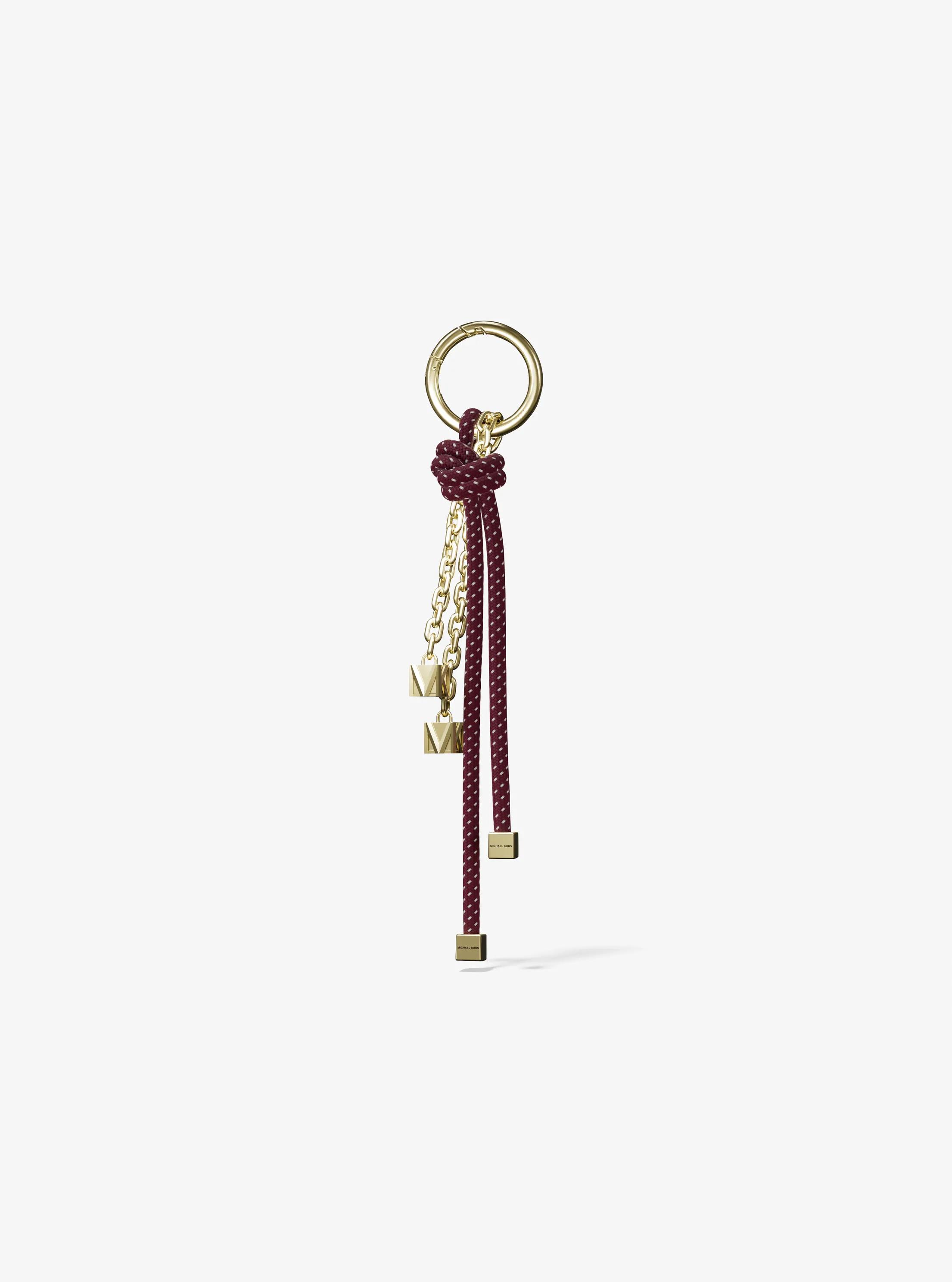 Colgante para bolso con cord&oacute;n en tono dorado y motas in MORA | Michael Kors