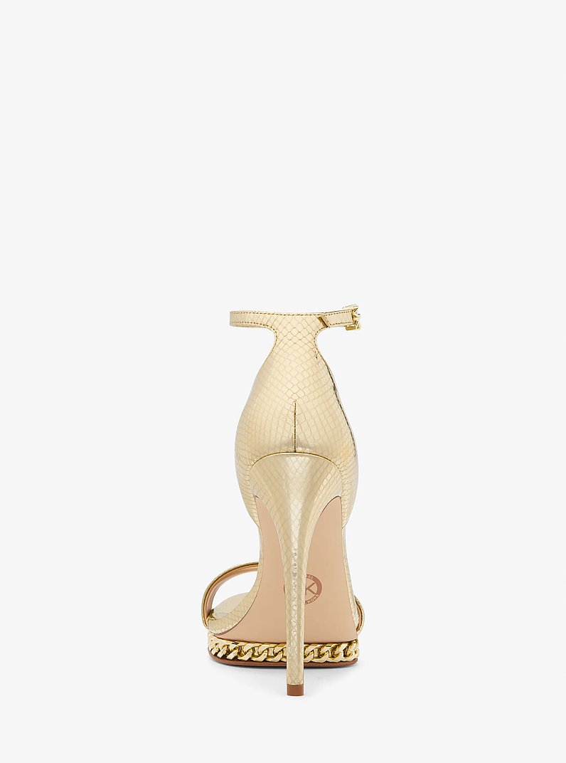 Sandalia Jordyn de piel metalizada con motivo de serpiente en relieve, plataforma y adornos in DORADO P&Aacute;LIDO | Michael Kors