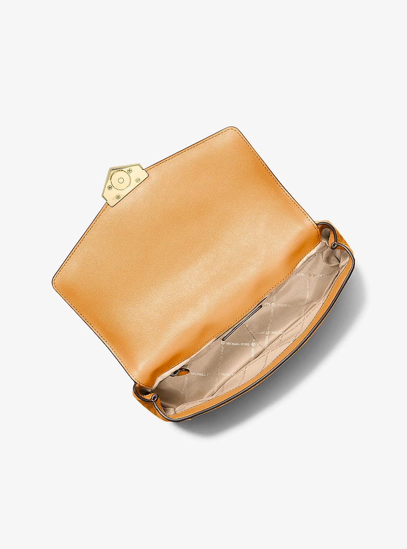Grand sac &agrave; &eacute;paule Soho &agrave; clous et &agrave; logo Signature in ORANGE ECLATANT | Michael Kors