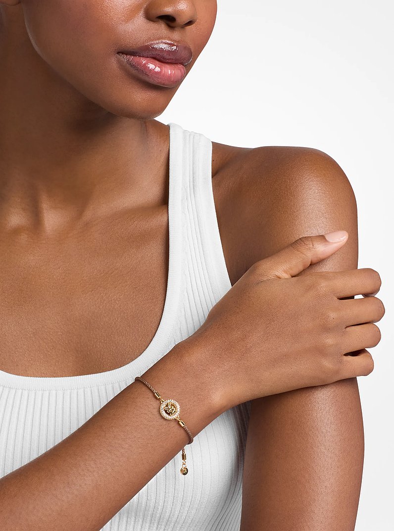 Kordelarmband mit Pav&eacute;-Logo im Goldton in ERDNUSS | Michael Kors