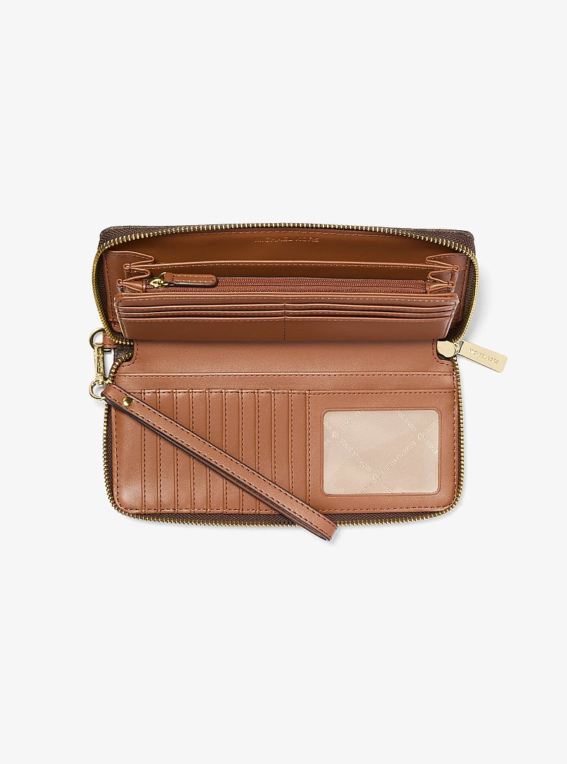 Bolso de pulsera continental Jet Set Travel grande con logotipo in MARR&Oacute;N | Michael Kors