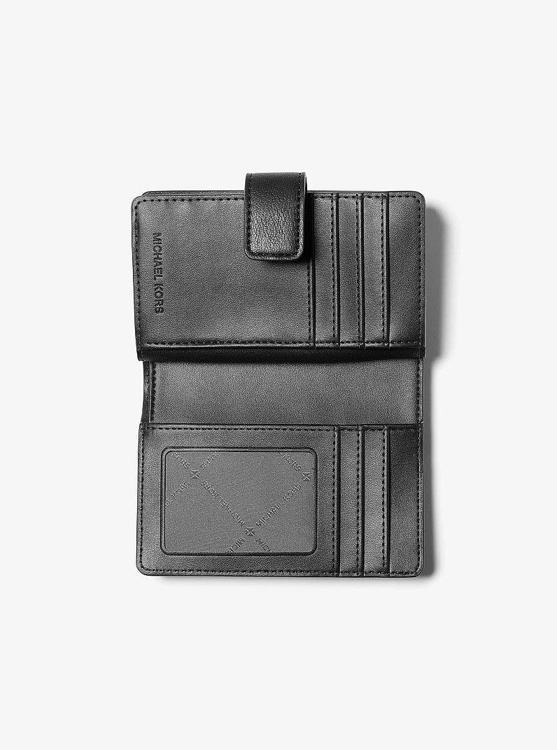 Billetera Jet Set Travel mediana con logotipo en relieve in NEGRO | Michael Kors