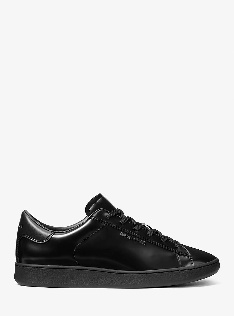 Reign Patent Leather Sneaker in BLACK | Michael Kors