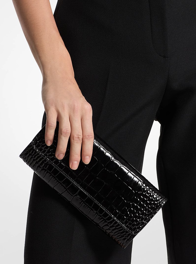 Cate Crocodile Embossed Patent Leather Clutch in BLACK | Michael Kors