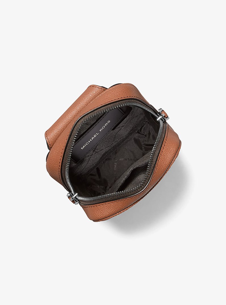 Cooper Logo Jacquard Sling Pack in LUGGAGE | Michael Kors