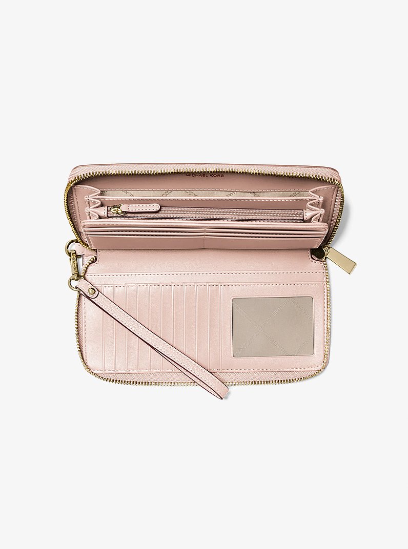Portafoglio continental Jet Set Travel grande in pelle martellata in ROSA TENUE | Michael Kors