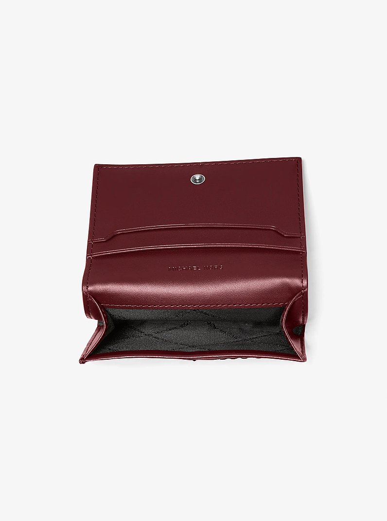 Portefeuille Hudson en cuir bruni gaufr&eacute; &agrave; logo in ROUGE POURPRE | Michael Kors