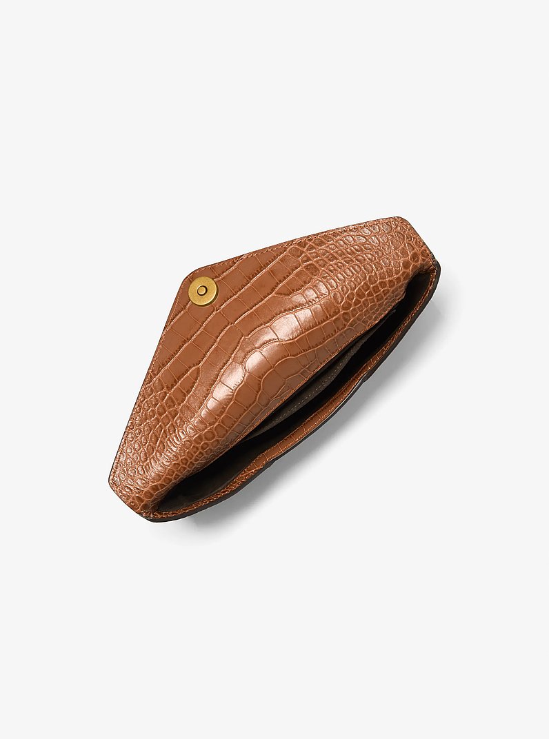 Mia Crocodile Embossed Leather Envelope Clutch in SADDLE | Michael Kors
