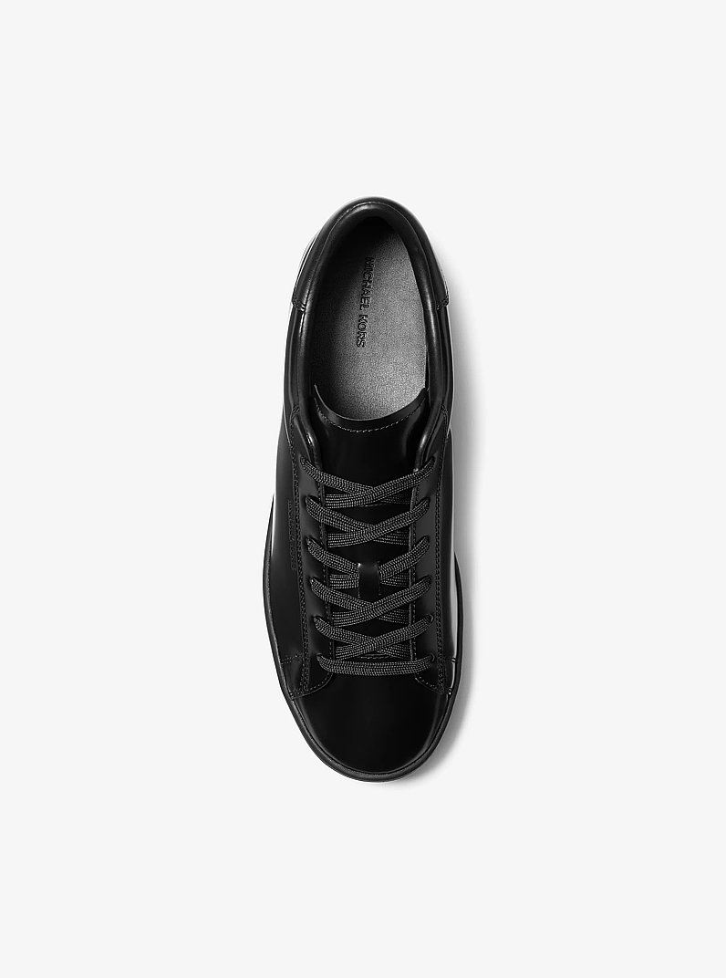 Reign Patent Leather Sneaker in BLACK | Michael Kors