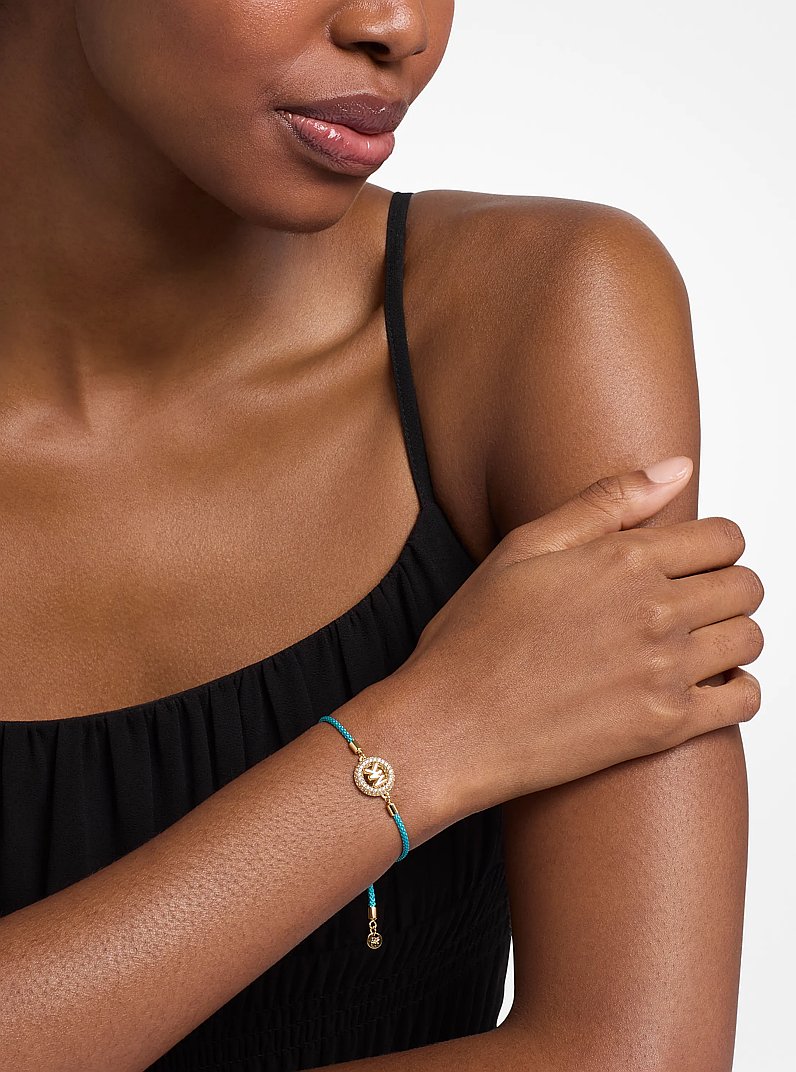 Kordelarmband mit Pav&eacute;-Logo im Goldton in T&Uuml;RKIS | Michael Kors