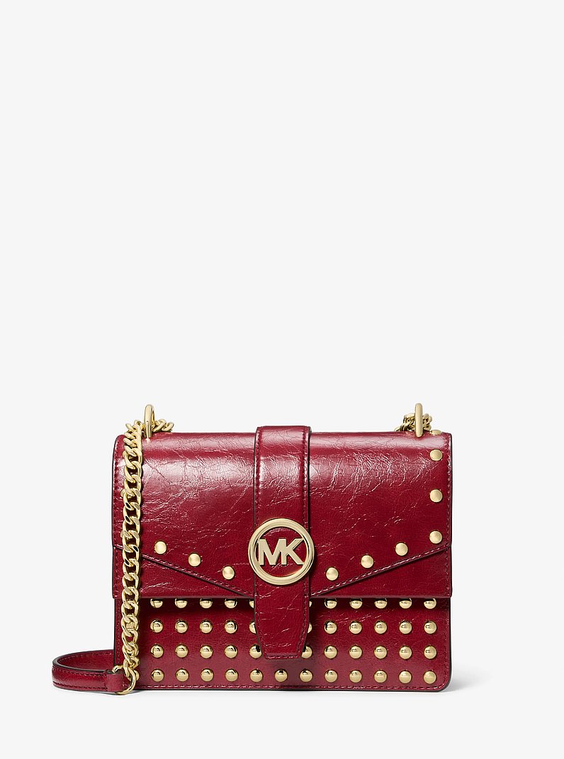 Petit sac &agrave; bandouli&egrave;re Greenwich &agrave; effet us&eacute; et &agrave; clous in CERISE | Michael Kors