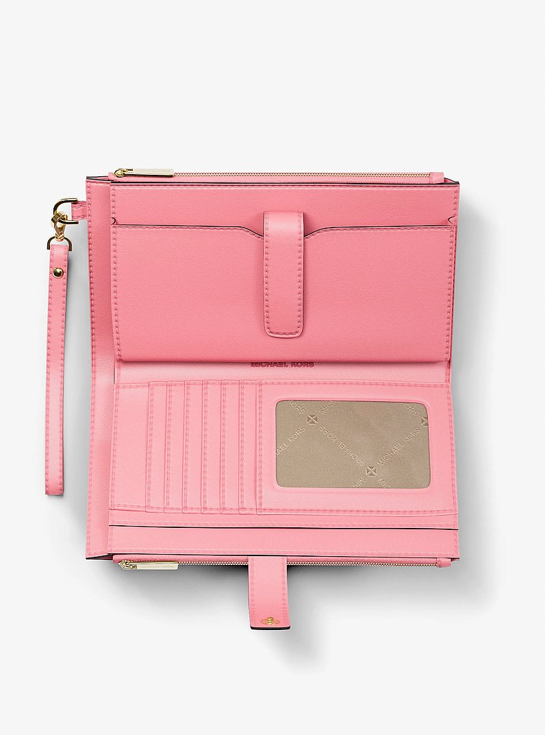 Grande pochette-bracelet Jet Set Travel &agrave; imprim&eacute; &agrave; logo Signature in &OElig;ILLET | Michael Kors