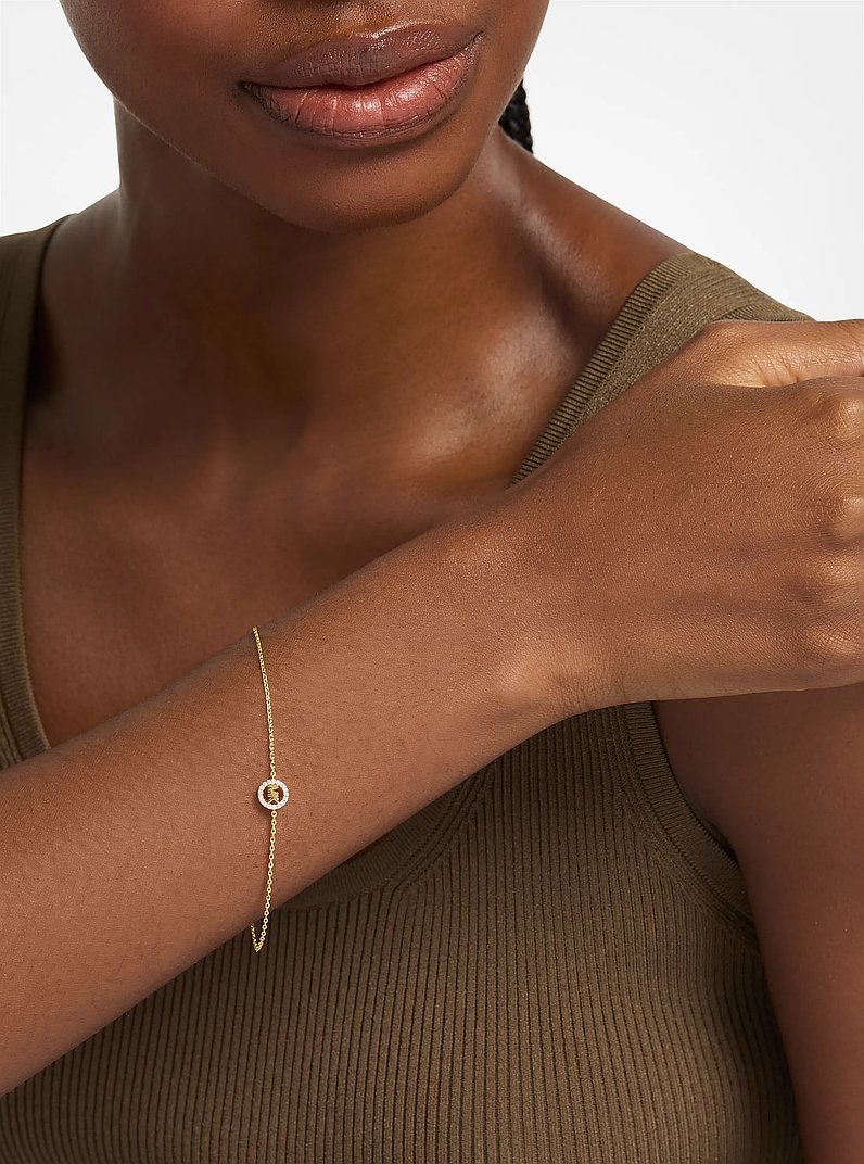 Bracciale con ciondolo pav&eacute; con logo in ORO | Michael Kors