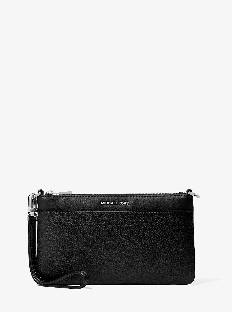 Pochette da polso convertibile Jet Set media in pelle martellata in NERO | Michael Kors