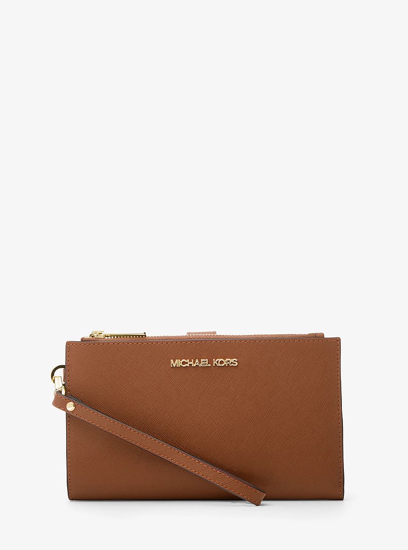 Cartera Jet Set grande de piel con tira de mu&ntilde;eca y compartimento para smartphone in LUGGAGE | Michael Kors