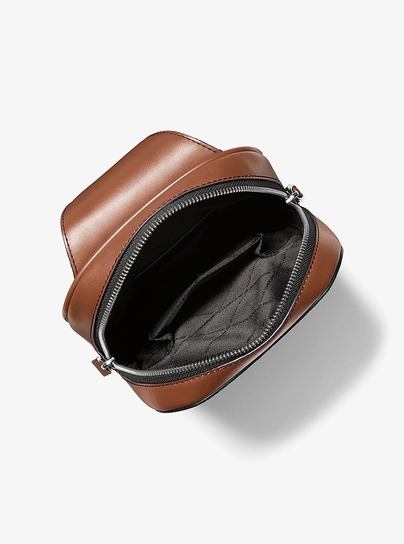 Cooper Slim Pebbled Leather Commuter Sling Pack in LUGGAGE | Michael Kors
