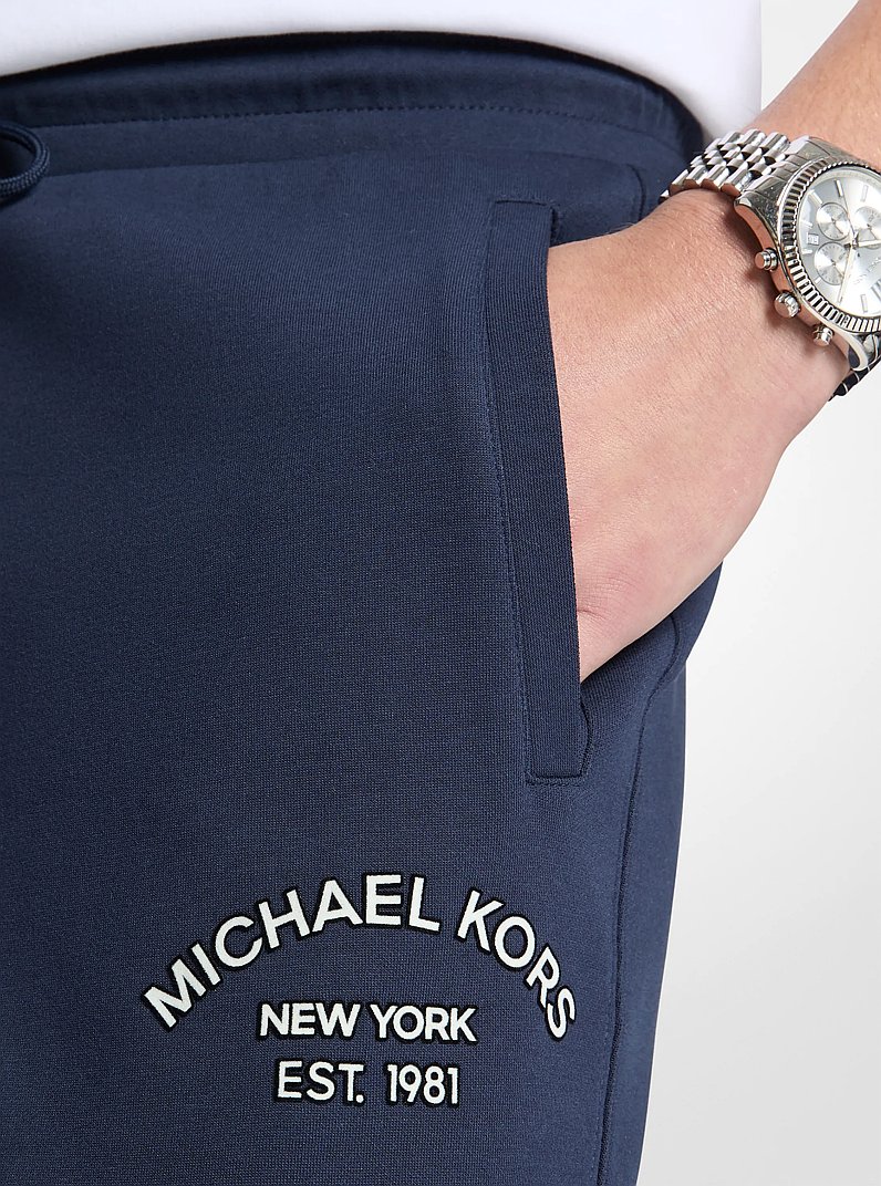 Pantalon tricot en m&eacute;lange de coton &agrave; logo in MINUIT | Michael Kors