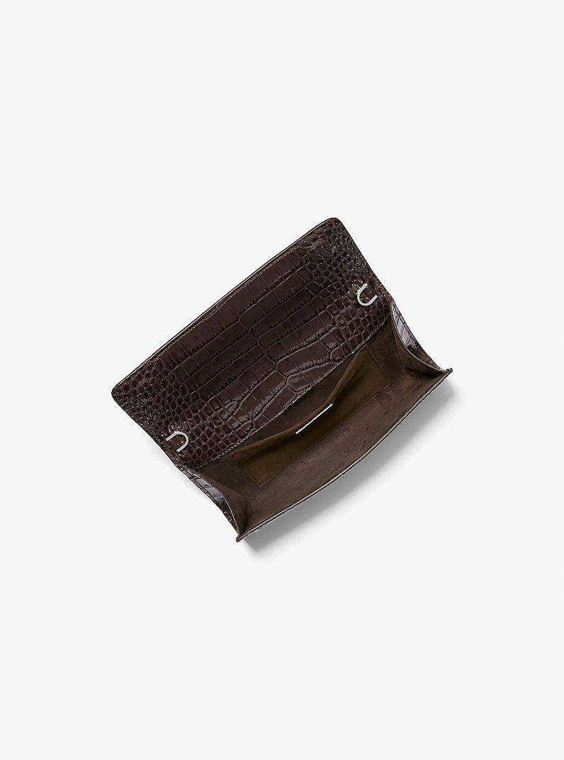 Cate Crocodile Embossed Patent Leather Clutch in CHOCOLATE | Michael Kors