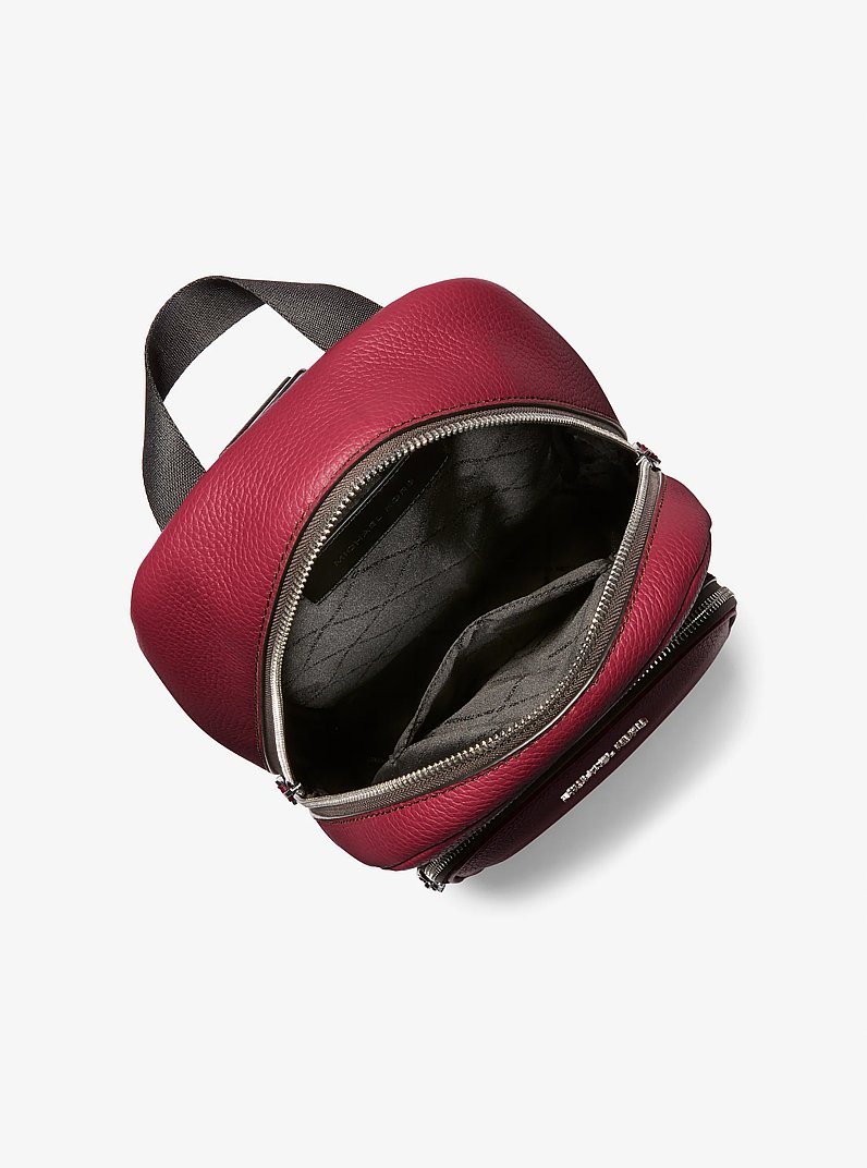 Cooper Pebbled Leather Sling Pack in CHERRY | Michael Kors