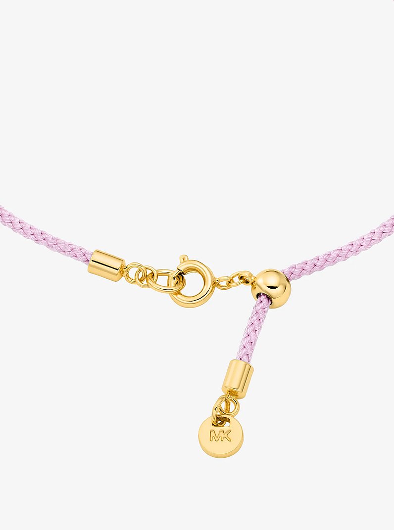 Pav&eacute; Gold-Tone Logo Corded Bracelet in PRIMROSE | Michael Kors