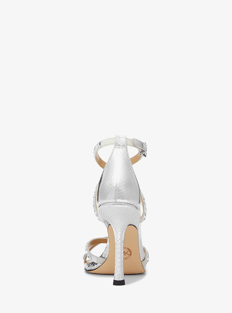 Celia Crystal Embellished Metallic Snake Embossed Sandal in SILVER | Michael Kors
