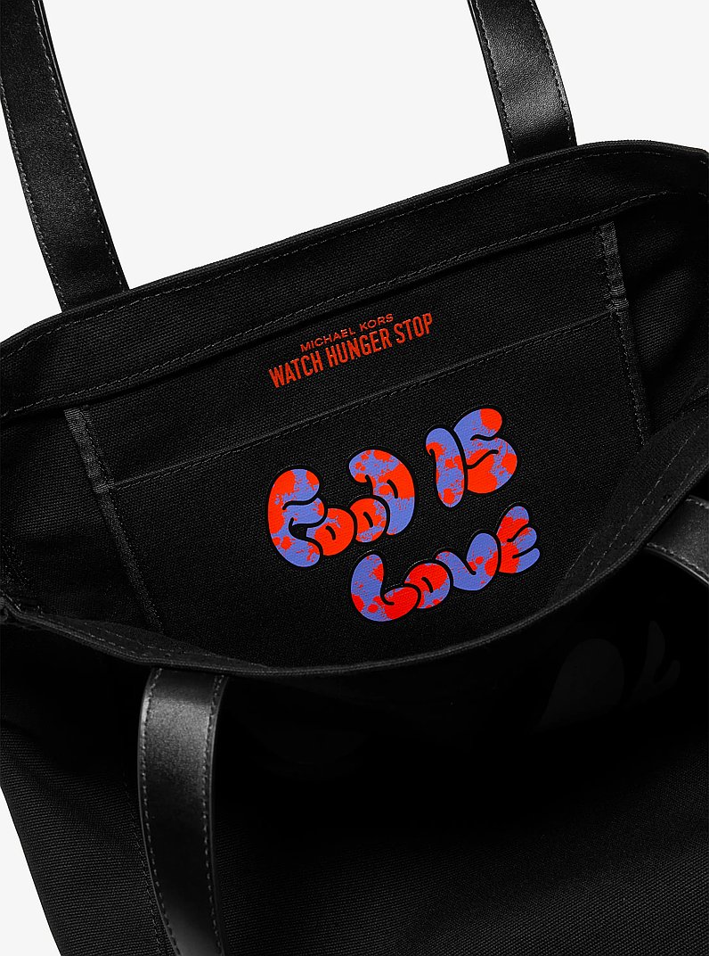 Watch Hunger Stop LOVE Large Cotton Canvas Tote Bag in BLACK | Michael Kors
