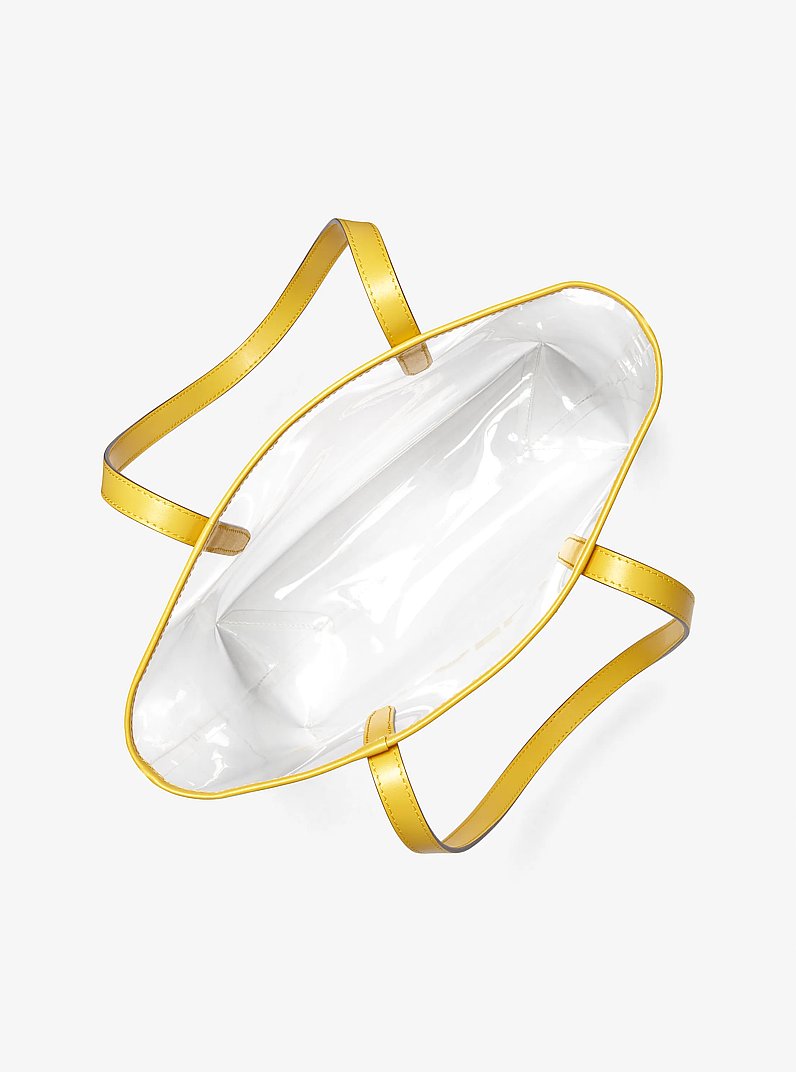 El bolso tote Michael grande de vinilo transparente in AMARILLO DORADO | Michael Kors