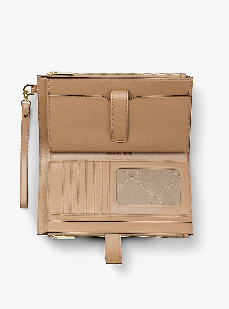Bolso pulsera Jet Set Travel grande con logotipo exclusivo estampado in CAMEL | Michael Kors