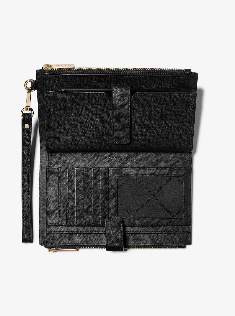Cartera Jet Set grande de piel con tira de mu&ntilde;eca y compartimento para smartphone in NEGRO | Michael Kors
