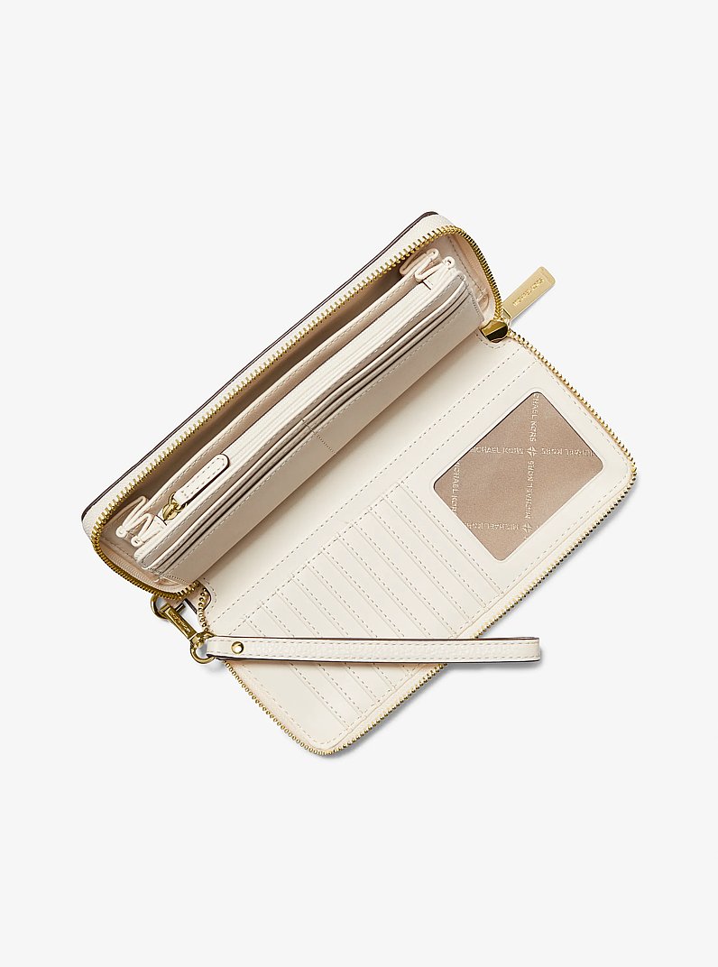 Jet Set Travel Large Pebbled Leather Wristlet in LT CREAM | Michael Kors