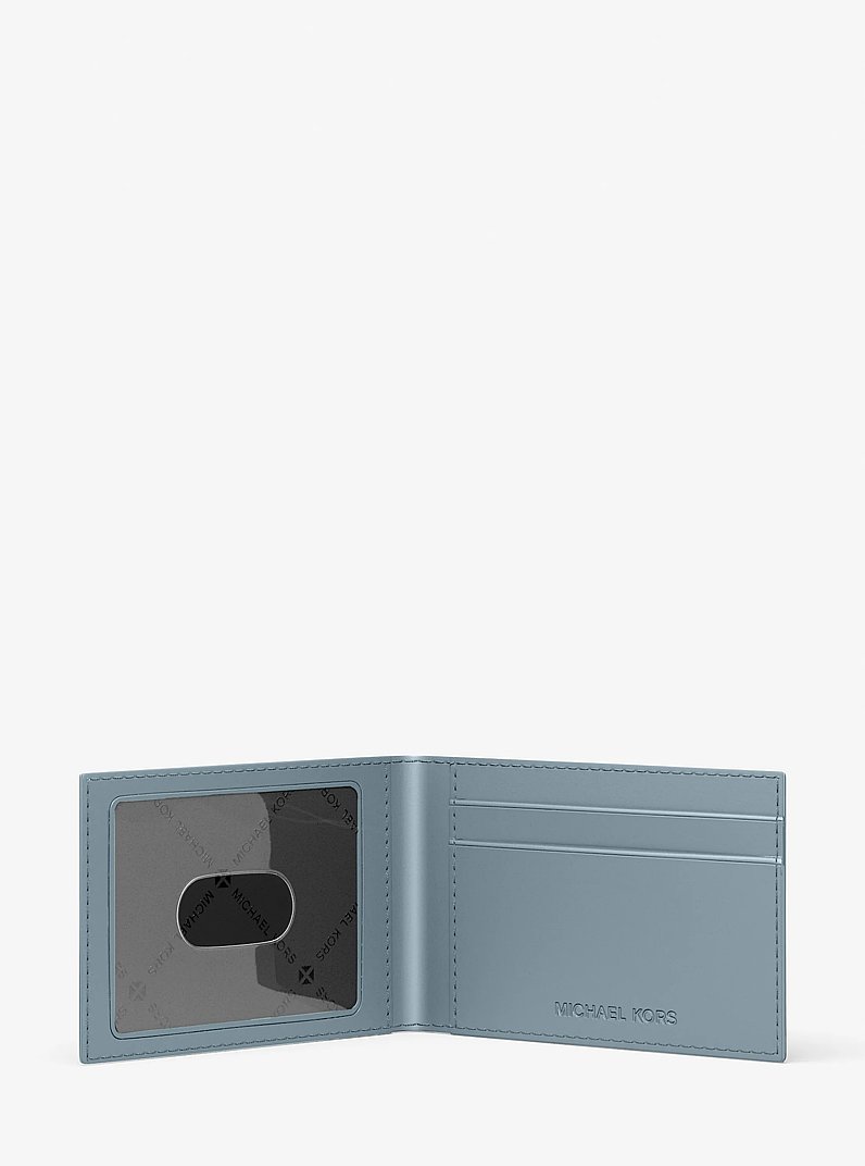 Hudson Logo Embossed Leather Billfold Wallet and Passcase in CHAMBRAY | Michael Kors