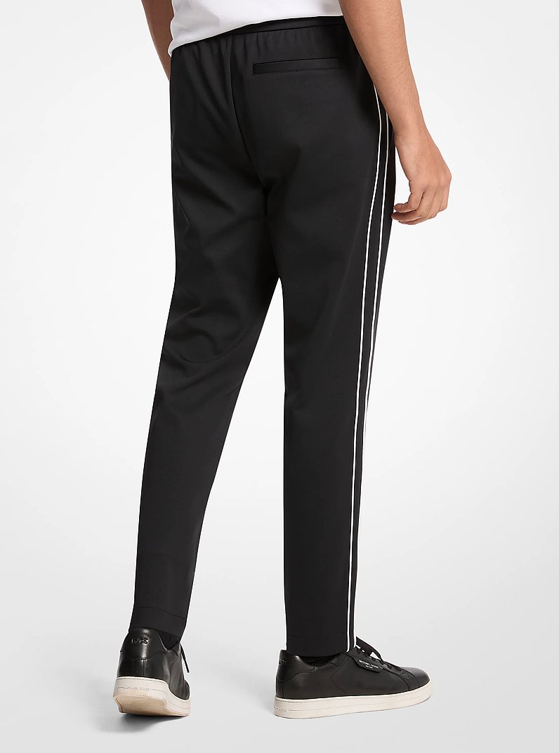 Pantaloni sportivi in nylon stretch con profili a contrasto in NERO | Michael Kors