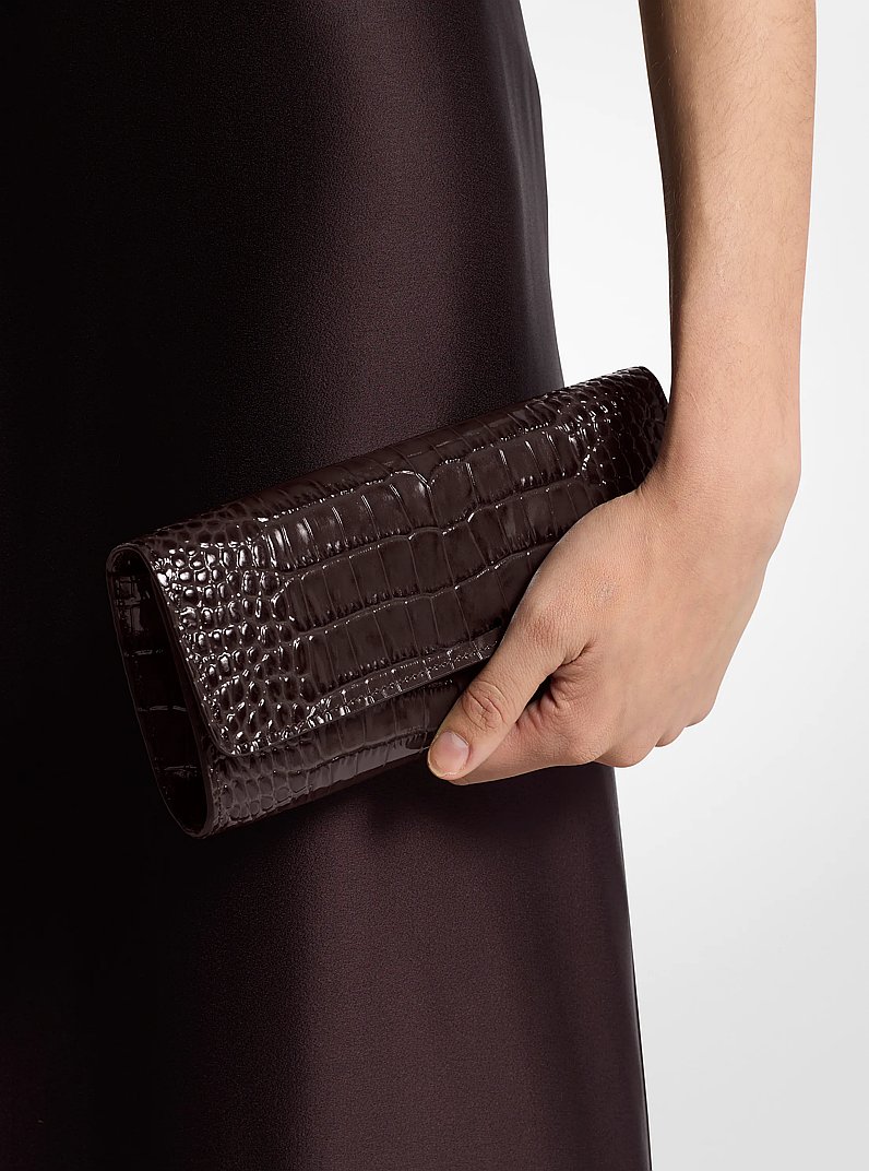 Cate Crocodile Embossed Patent Leather Clutch in CHOCOLATE | Michael Kors