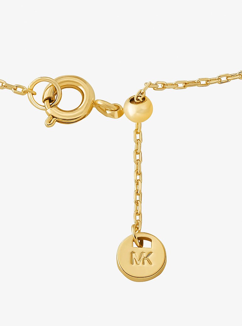 Bracciale con ciondolo pav&eacute; con logo in ORO | Michael Kors