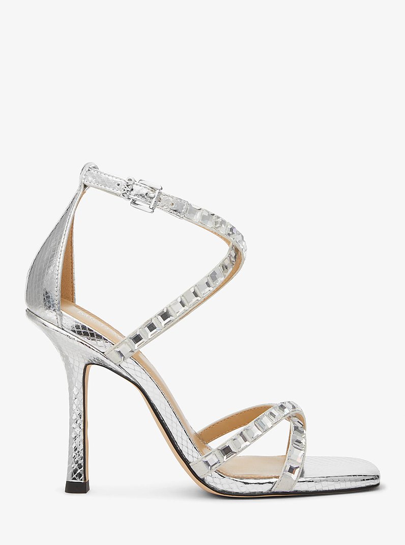Celia Crystal Embellished Metallic Snake Embossed Sandal in SILVER | Michael Kors
