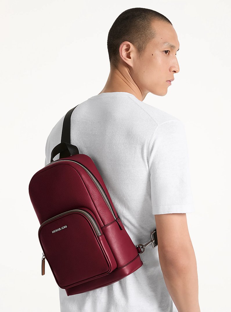Cooper Pebbled Leather Sling Pack in CHERRY | Michael Kors