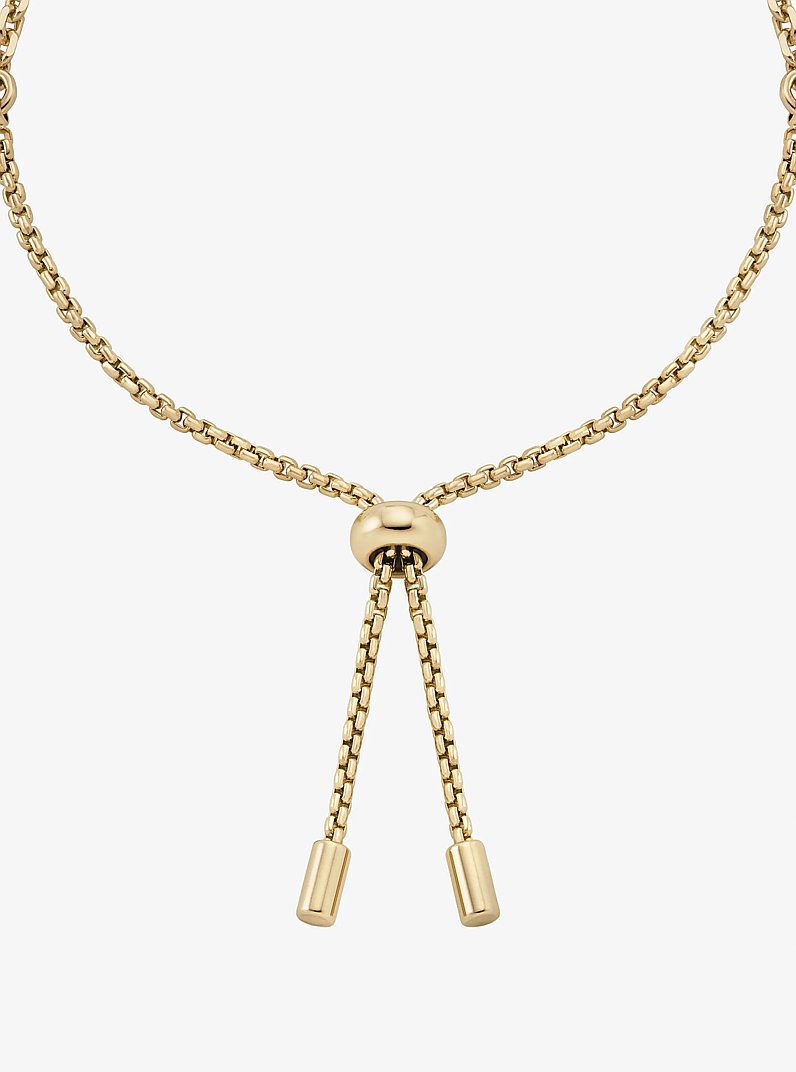 Pulsera deslizante de candado con incrustaciones in DORADO | Michael Kors