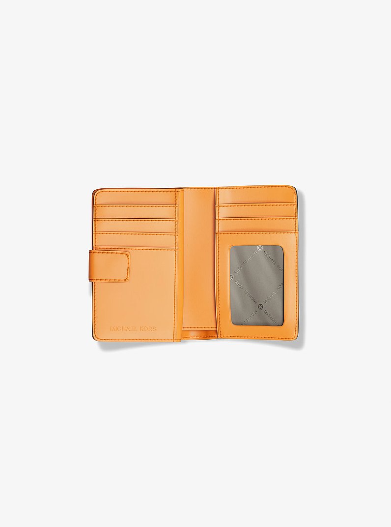 Jet Set Printed Signature Logo Bi-Fold Wallet in POP ORANGE | Michael Kors