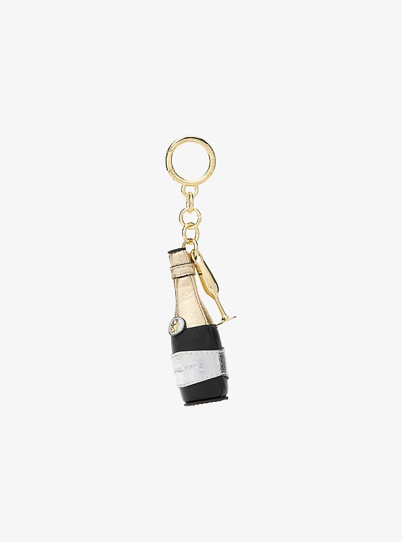 Breloque pour sac en forme de bouteille de champagne in OR/NOIR | Michael Kors
