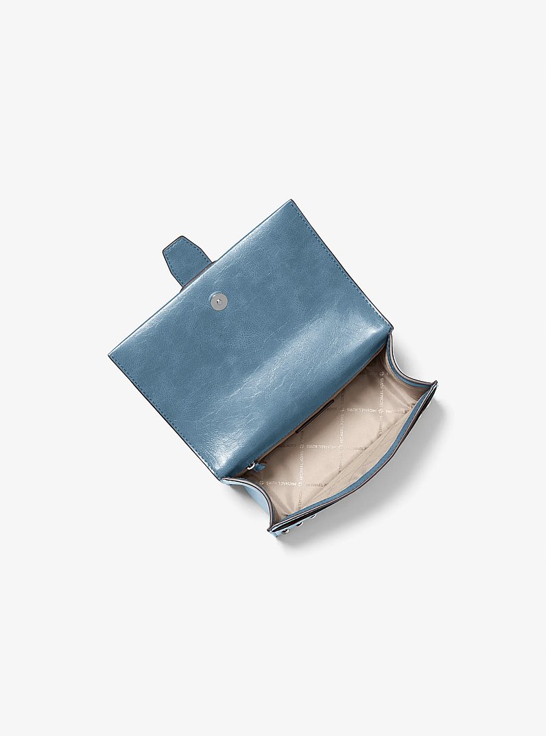 Petit sac &agrave; bandouli&egrave;re Greenwich &agrave; effet us&eacute; et &agrave; clous in BLEUET | Michael Kors
