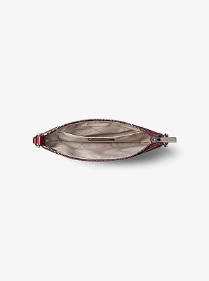 Petite pochette-bracelet Jet Set convertible en cuir grain&eacute;