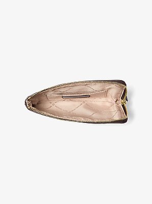 Petite pochette-bracelet Jet Set Travel brunie &agrave; logo gaufr&eacute;