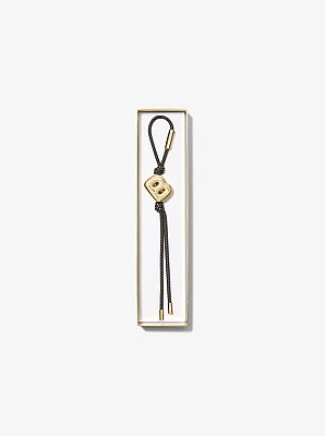 Colgante de inicial para bolso con cord&oacute;n en tono dorado y motas