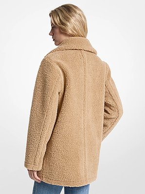Manteau pelucheux en fausse fourrure
