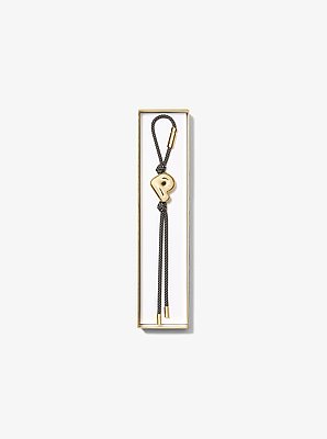 Breloque de sac initiale dor&eacute;e avec cordon mouchet&eacute;