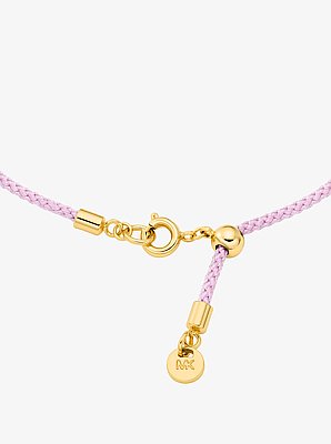 Armband met logo met siersteentjes en koord, goudkleurig